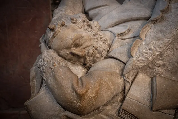 Detail of a carved stone memorial figure in the cathedral