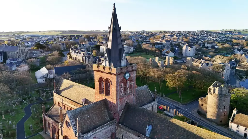 Aerial view of the cathedral tower and spire over Kirkwall