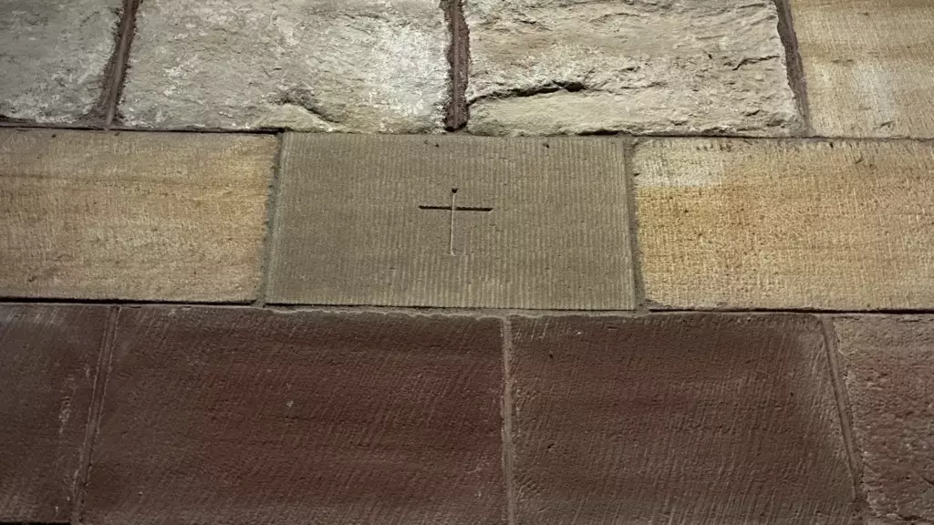 A mason's mark cut into the stone